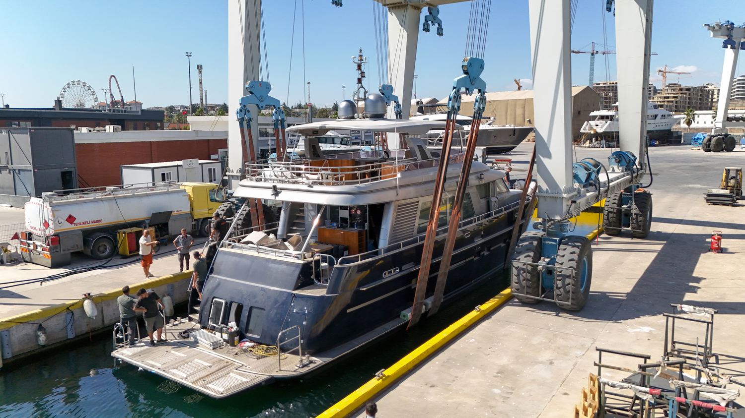 The yard with yachts alongside and the travel lift