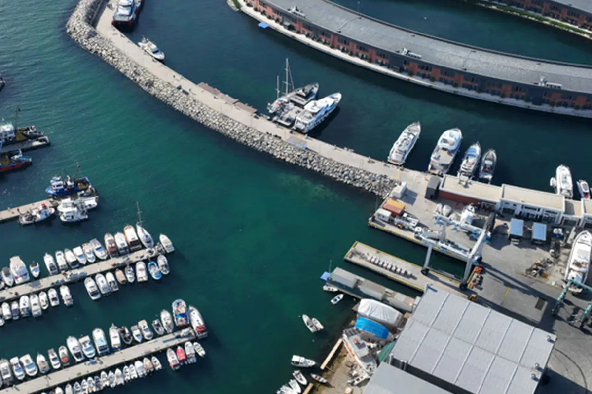Aerial view of the marina entrance, pontoons and covered buildings
