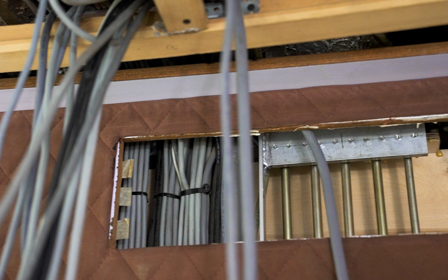 Open interior lining revealing cable routes